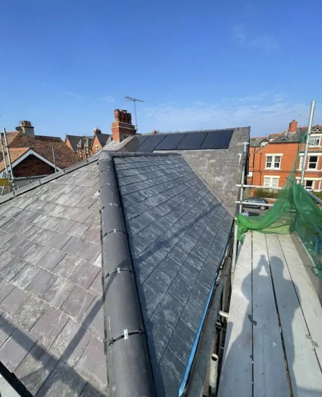 Close up of new slate roof and lead valley work